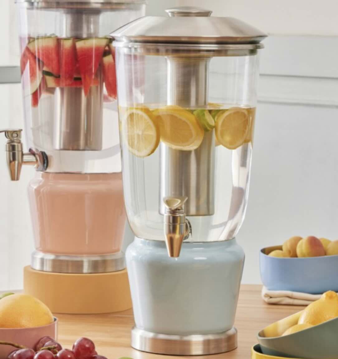 Luminique Dispenser in powder blue with water infused with fresh oranges.