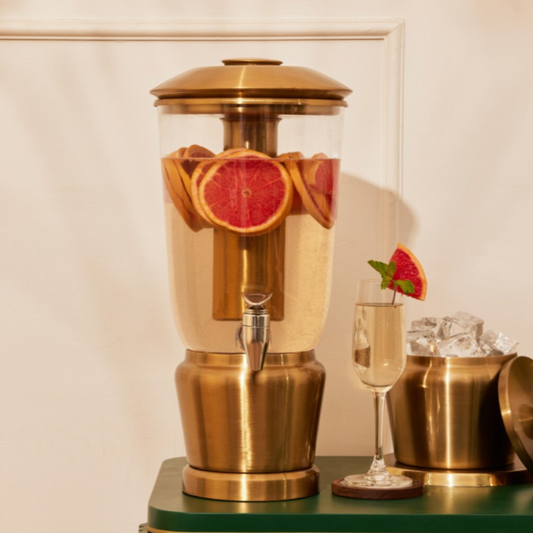 Gilded Gold Luminique dispenser in Vibrant Brass Finish filled