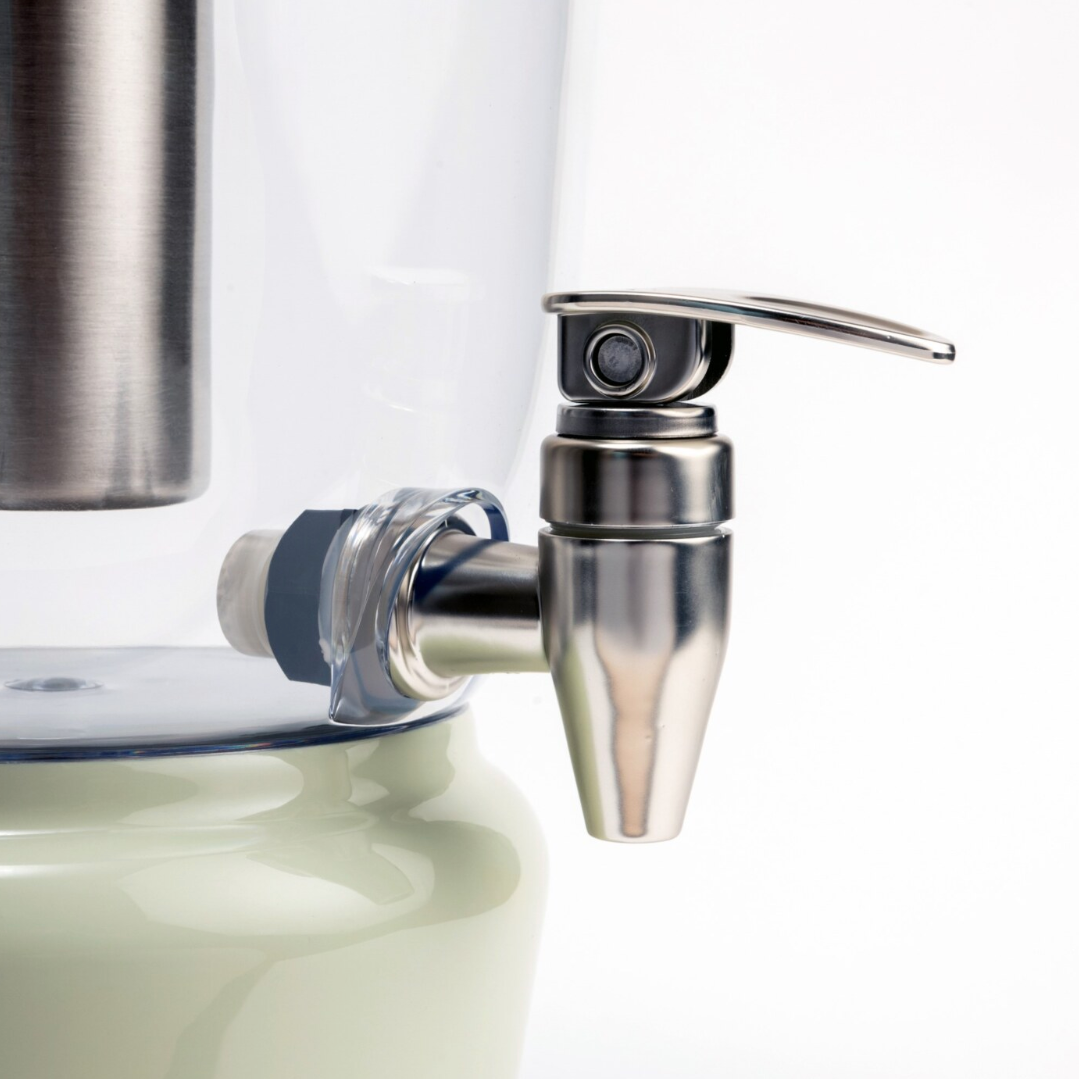 Mellow Sage Luminique dispenser in subtle mint green with a high-quality spigot tap in stainless steel