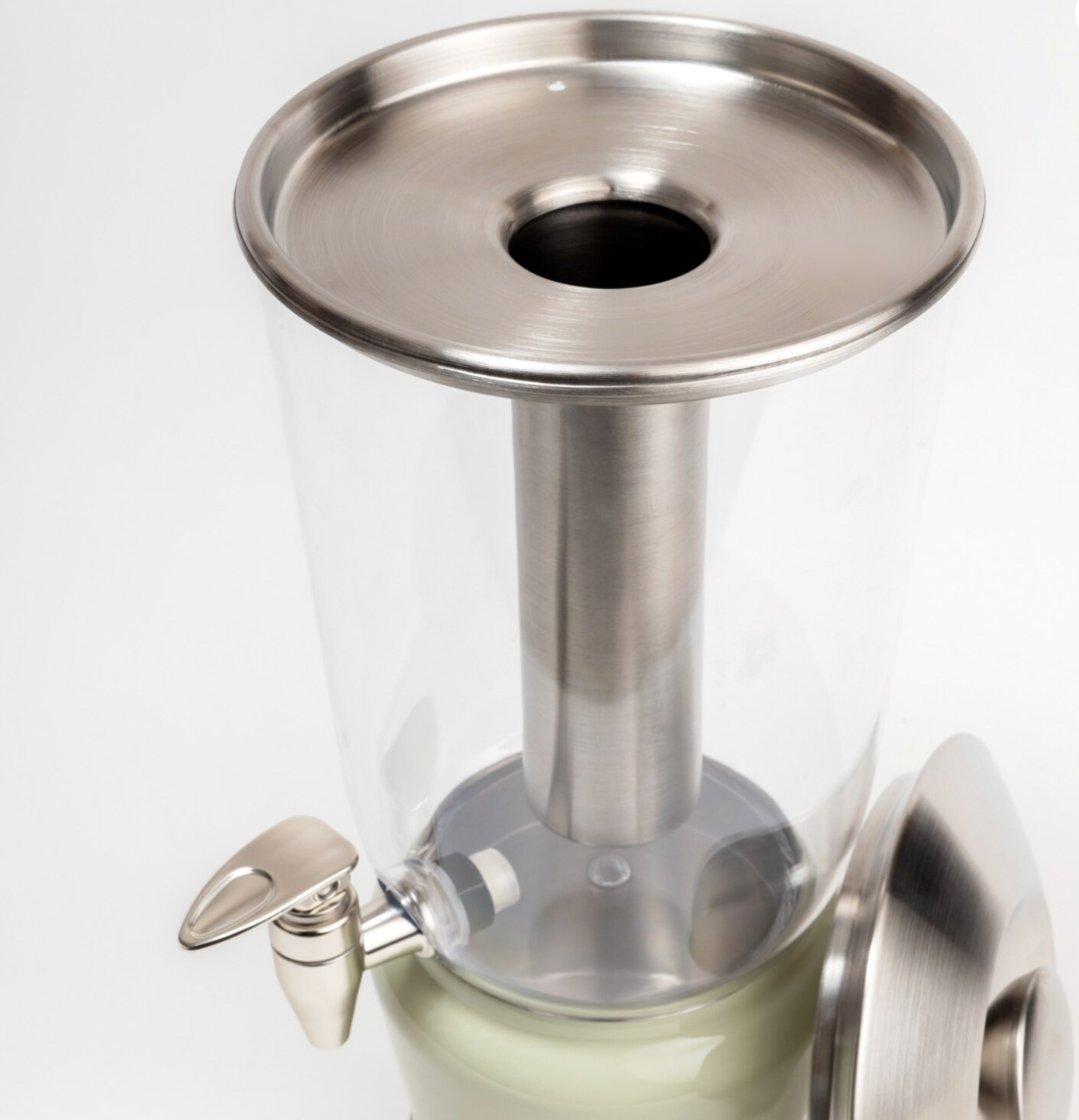 Mellow Sage Luminique dispenser in subtle mint green in stainless steel and BPA free acrylic, with a openable top for easy access and cleaning