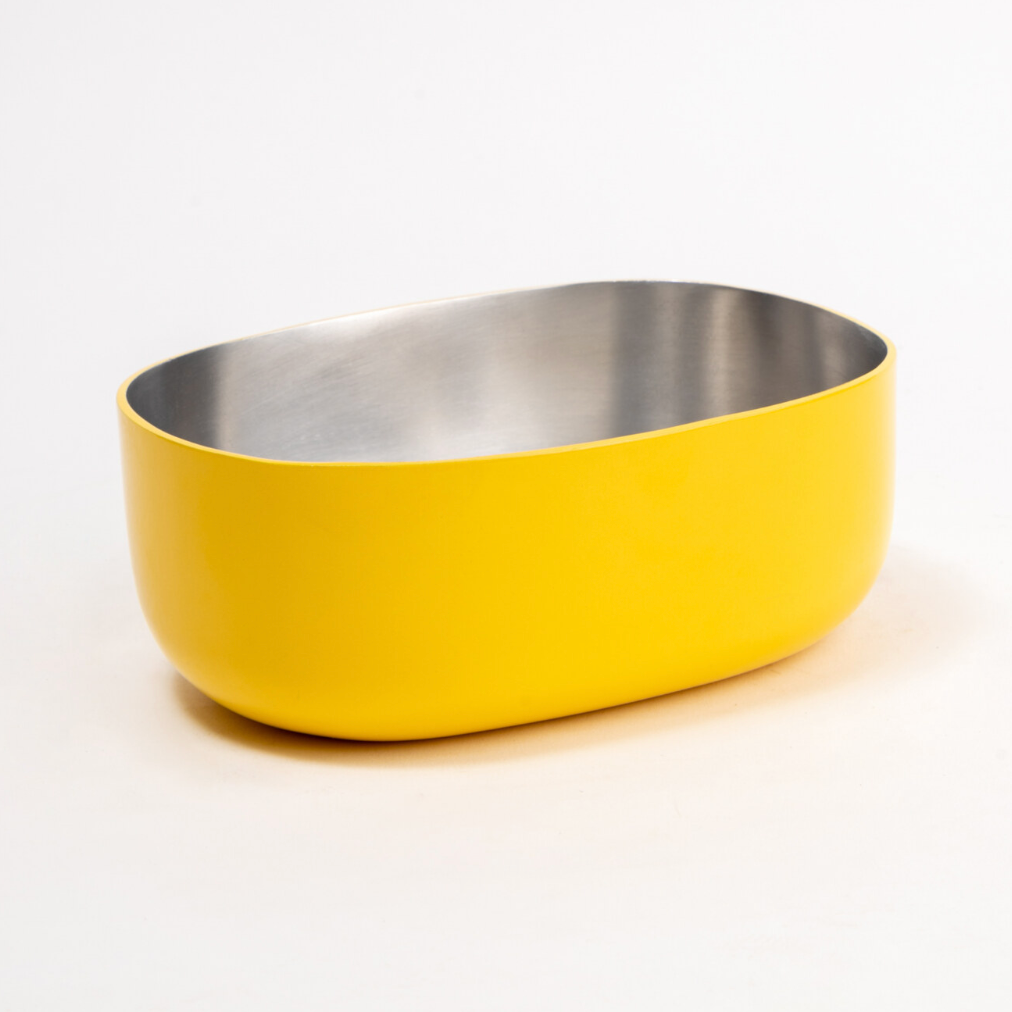 Top view of a stainless steel Celestique Bowl in citrus burst yellow with silver interior
