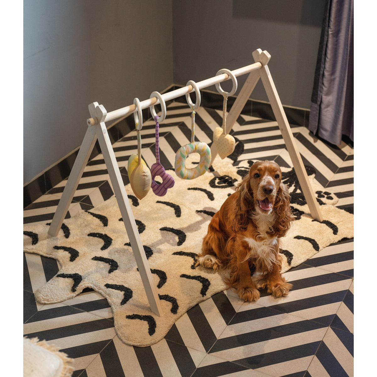 Colorful baby play gym with hanging plush toys for early development