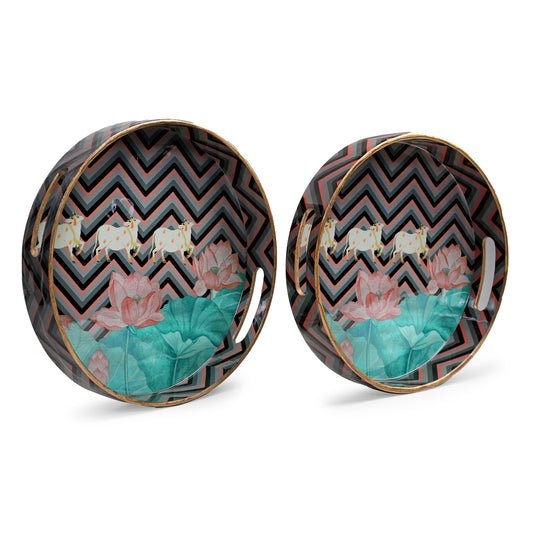 Set of two round glossy trays by Artychoke featuring a chevron design with Nandi and lotus motifs, perfect for serving or as decorative centerpieces.